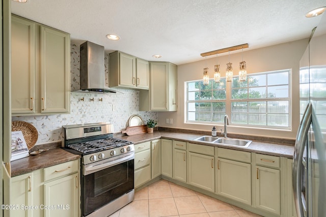 485 Poinciana Dr, Melbourne, FL 32935 - kitchen with appliances with stainless steel finishes, wall chimney exhaust hood, a sink, dark countertops, and light tile patterned flooring