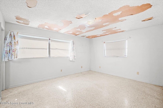 1155 Montego Bay Dr N, Merritt Island, FL 32953 - empty room featuring speckle patterned floor and a textured ceiling