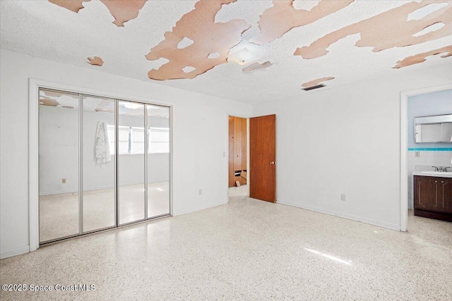 1155 Montego Bay Dr N, Merritt Island, FL 32953 - unfurnished room featuring dark aggregate flooring and a textured ceiling