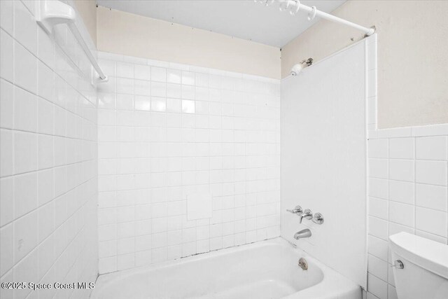 1155 Montego Bay Dr N, Merritt Island, FL 32953 - full bath featuring tile walls and shower / bath combination