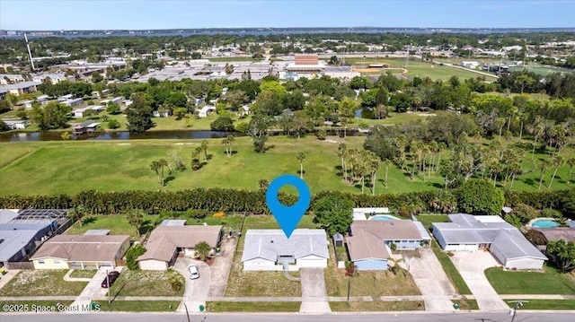 1155 Montego Bay Dr N, Merritt Island, FL 32953 - aerial perspective of suburban area with a nearby body of water and a tree filled landscape
