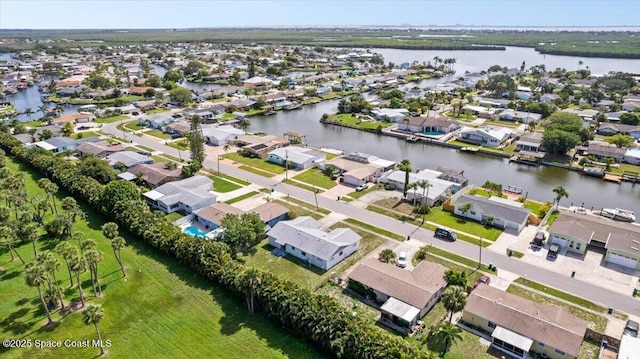 1155 Montego Bay Dr N, Merritt Island, FL 32953 - aerial perspective of suburban area with a nearby body of water