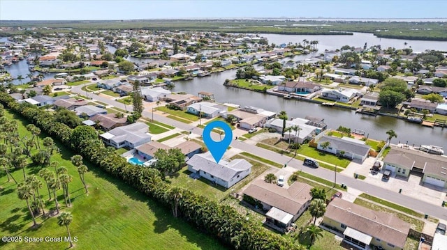 1155 Montego Bay Dr N, Merritt Island, FL 32953 - aerial view of residential area featuring a nearby body of water
