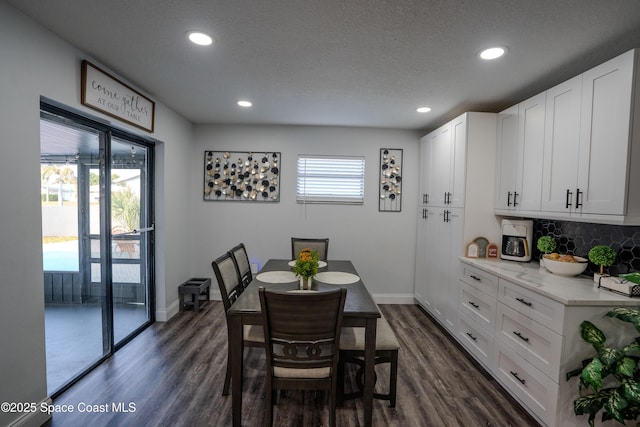629 Tupelo Dr, Melbourne, FL 32935 - dining space featuring recessed lighting, dark wood finished floors, baseboards, and a textured ceiling