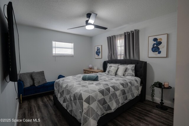 629 Tupelo Dr, Melbourne, FL 32935 - bedroom with a textured ceiling, wood finished floors, baseboards, and a ceiling fan