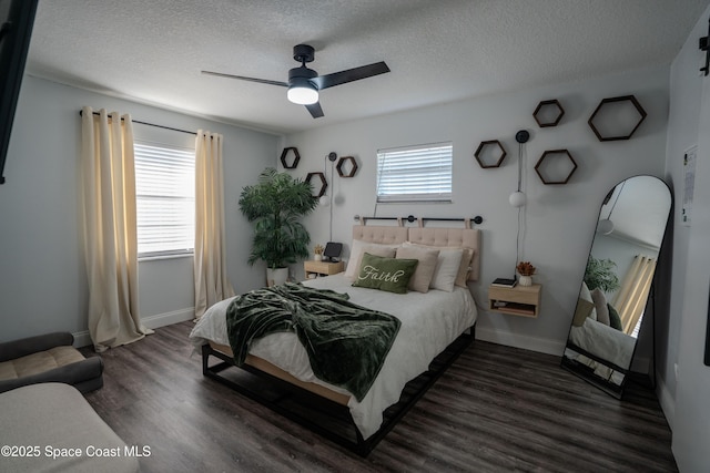 629 Tupelo Dr, Melbourne, FL 32935 - bedroom with a textured ceiling, wood finished floors, baseboards, and a ceiling fan