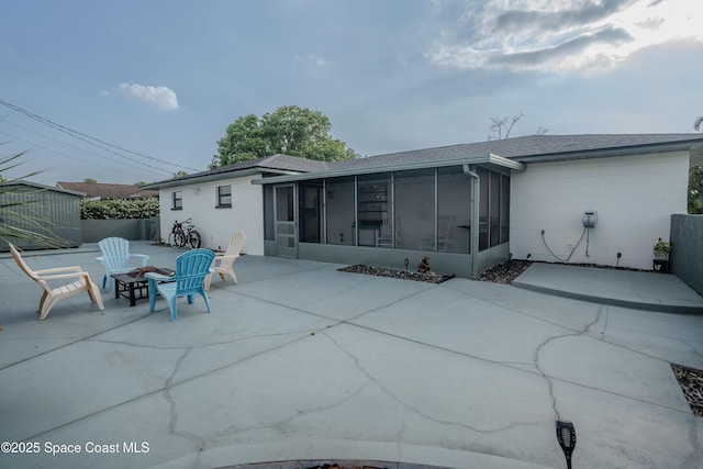 629 Tupelo Dr, Melbourne, FL 32935 - rear view of property featuring a sunroom and a patio area