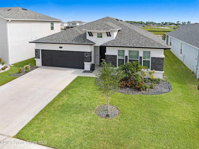 2365 Roygaris St NW, Palm Bay, FL 32907 - view of front facade featuring a shingled roof, an attached garage, stone siding, and a front lawn