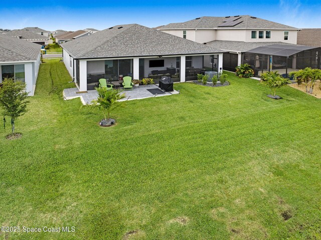 2365 Roygaris St NW, Palm Bay, FL 32907 - rear view of property featuring roof with shingles, a patio, a lawn, and stucco siding