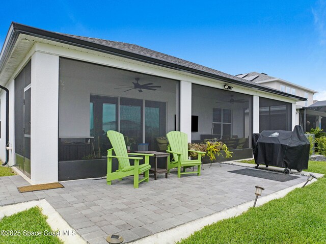 2365 Roygaris St NW, Palm Bay, FL 32907 - rear view of house with a sunroom, a ceiling fan, and a patio
