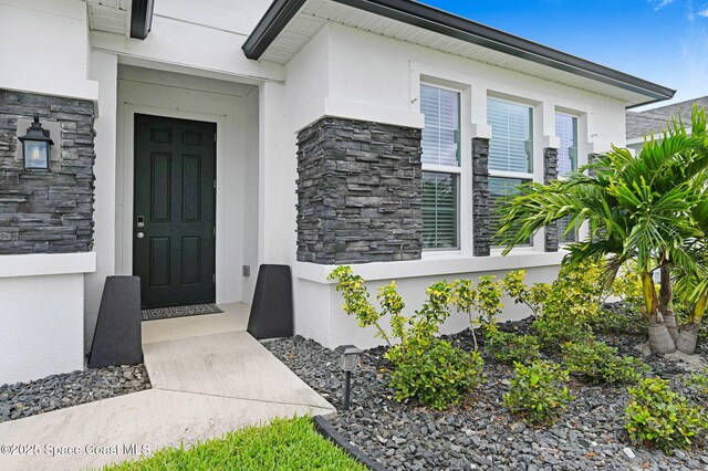 2365 Roygaris St NW, Palm Bay, FL 32907 - entrance to property featuring stone siding and stucco siding