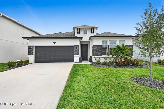 2365 Roygaris St NW, Palm Bay, FL 32907 - prairie-style house with stucco siding, an attached garage, a front lawn, and driveway