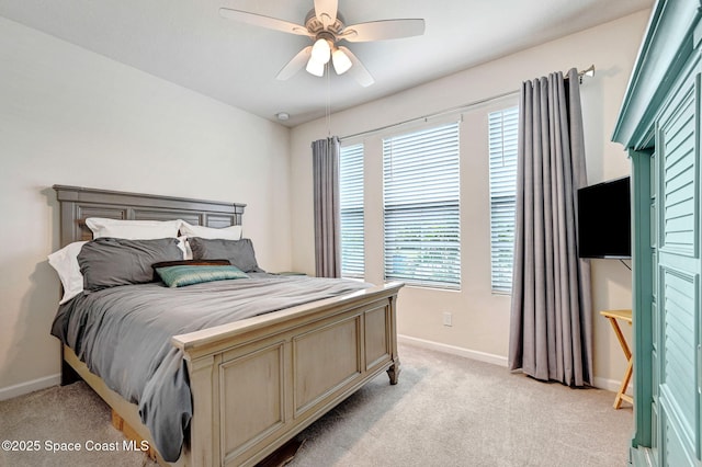 2365 Roygaris St NW, Palm Bay, FL 32907 - bedroom with baseboards, light carpet, multiple windows, and a ceiling fan