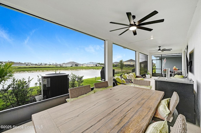 2365 Roygaris St NW, Palm Bay, FL 32907 - wooden deck featuring a water view, a ceiling fan, cooling unit, and outdoor dining area