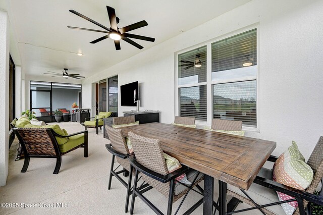 2365 Roygaris St NW, Palm Bay, FL 32907 - view of patio / terrace featuring a ceiling fan, an outdoor hangout area, and outdoor dining space