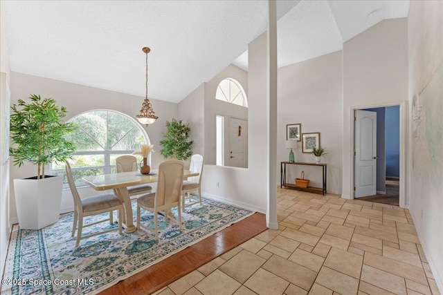 1090 Spring Oak Dr, Melbourne, FL 32901 - dining room with high vaulted ceiling and a chandelier