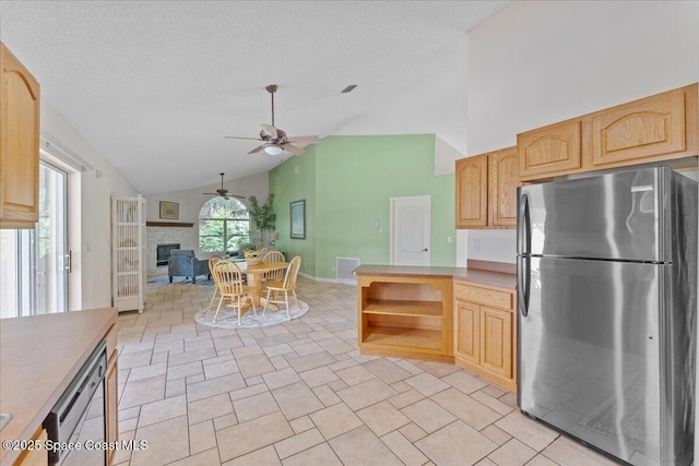 1090 Spring Oak Dr, Melbourne, FL 32901 - kitchen featuring freestanding refrigerator, a ceiling fan, light brown cabinetry, open floor plan, and high vaulted ceiling