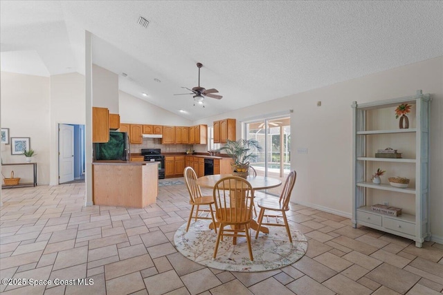 1090 Spring Oak Dr, Melbourne, FL 32901 - dining area featuring ceiling fan, a textured ceiling, and high vaulted ceiling