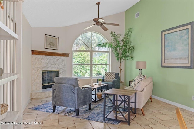 1090 Spring Oak Dr, Melbourne, FL 32901 - living area featuring ceiling fan, a stone fireplace, and high vaulted ceiling