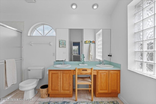 1090 Spring Oak Dr, Melbourne, FL 32901 - full bathroom featuring double vanity, an enclosed shower, and tile patterned floors