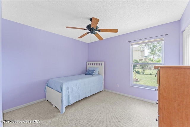 1090 Spring Oak Dr, Melbourne, FL 32901 - carpeted bedroom with a ceiling fan and a textured ceiling