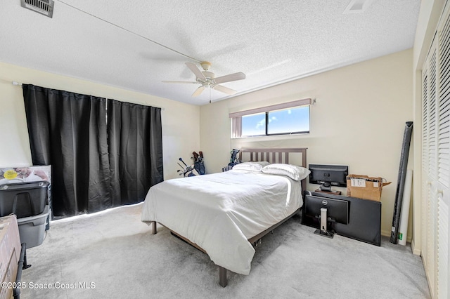 525 Summerset Ct, Indian Harbour Beach, FL 32937 - bedroom with carpet floors, a ceiling fan, a textured ceiling, and a closet