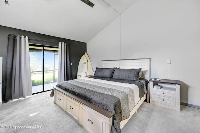 525 Summerset Ct, Indian Harbour Beach, FL 32937 - bedroom featuring access to outside, light carpet, and high vaulted ceiling