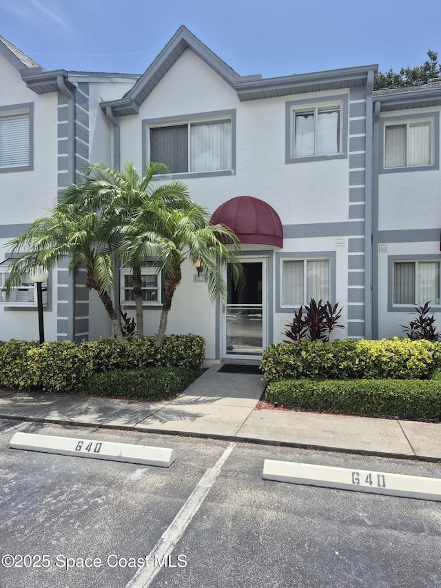 640 Seaport Blvd Unit 224, Cape Canaveral, FL 32920 - townhome / multi-family property featuring uncovered parking and stucco siding