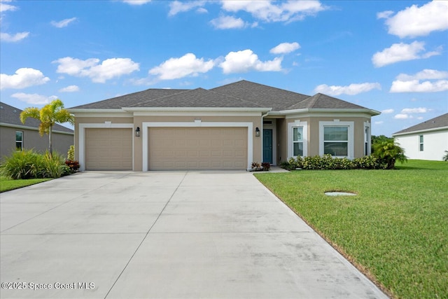 8342 Laguna Cir, Micco, FL 32976 - view of front of house featuring an attached garage, stucco siding, driveway, a front lawn, and a shingled roof