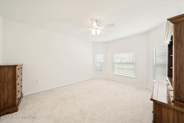 8342 Laguna Cir, Micco, FL 32976 - unfurnished bedroom with light carpet, baseboards, and ceiling fan