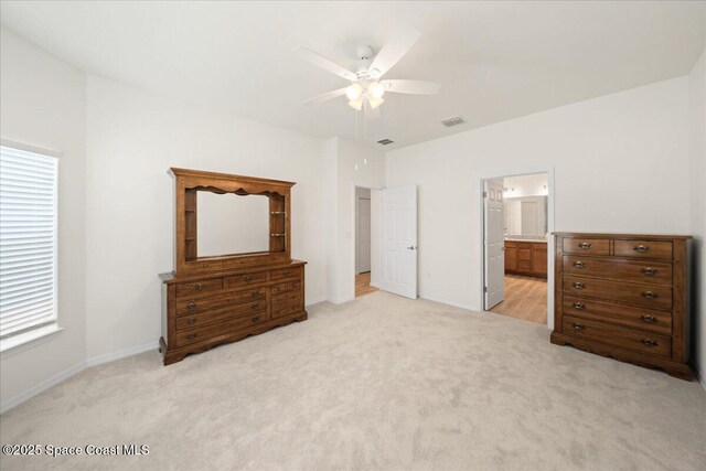 8342 Laguna Cir, Micco, FL 32976 - bedroom featuring light carpet, baseboards, and ceiling fan