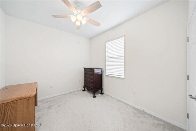 8342 Laguna Cir, Micco, FL 32976 - unfurnished bedroom with light carpet, baseboards, and a ceiling fan