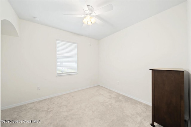 8342 Laguna Cir, Micco, FL 32976 - empty room with light colored carpet, a ceiling fan, and baseboards
