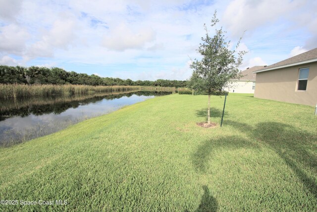8342 Laguna Cir, Micco, FL 32976 - view of green lawn featuring a water view