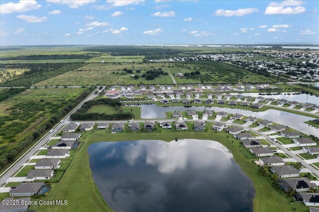 8342 Laguna Cir, Micco, FL 32976 - aerial view of property's location with a large body of water and nearby suburban area