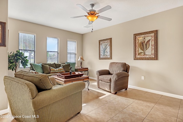 681 Ventura Dr, Satellite Beach, FL 32937 - living room with healthy amount of natural light, baseboards, ceiling fan, and light tile patterned floors