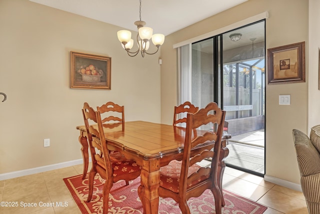 681 Ventura Dr, Satellite Beach, FL 32937 - dining space with a chandelier, baseboards, and light tile patterned flooring