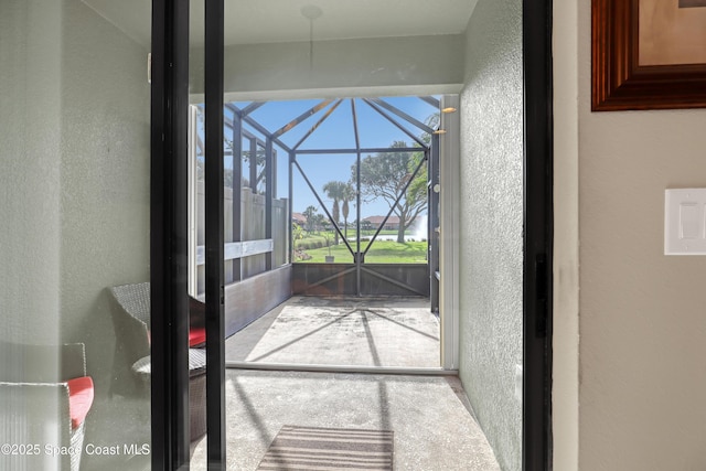 681 Ventura Dr, Satellite Beach, FL 32937 - doorway featuring a sunroom and a textured wall