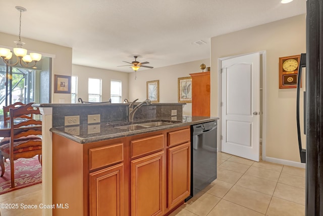 681 Ventura Dr, Satellite Beach, FL 32937 - kitchen featuring a sink, dishwasher, a center island with sink, light tile patterned floors, and a ceiling fan