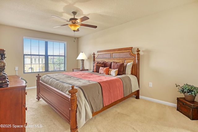 681 Ventura Dr, Satellite Beach, FL 32937 - bedroom with light carpet, baseboards, and a ceiling fan
