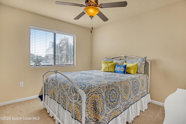 681 Ventura Dr, Satellite Beach, FL 32937 - bedroom with carpet flooring, baseboards, and ceiling fan