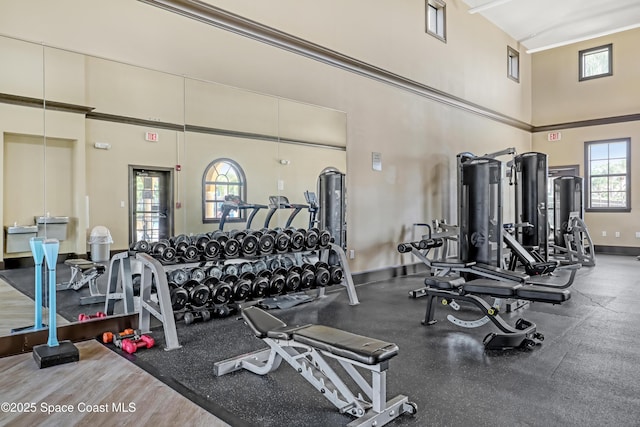 681 Ventura Dr, Satellite Beach, FL 32937 - gym with a towering ceiling and baseboards