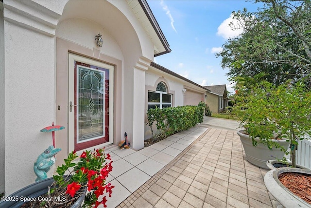 1250 Corning Ave NW, Palm Bay, FL 32907 - entrance to property featuring stucco siding and a garage