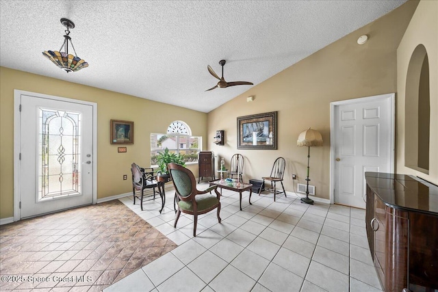 1250 Corning Ave NW, Palm Bay, FL 32907 - foyer entrance with plenty of natural light, lofted ceiling, a textured ceiling, baseboards, and a ceiling fan
