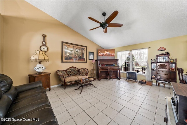 1250 Corning Ave NW, Palm Bay, FL 32907 - living area with a ceiling fan, light tile patterned flooring, a textured ceiling, lofted ceiling, and baseboards