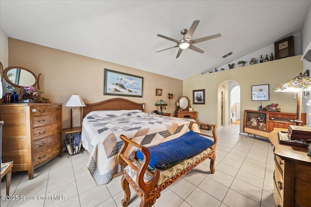 1250 Corning Ave NW, Palm Bay, FL 32907 - bedroom with arched walkways, light tile patterned floors, vaulted ceiling, and a ceiling fan