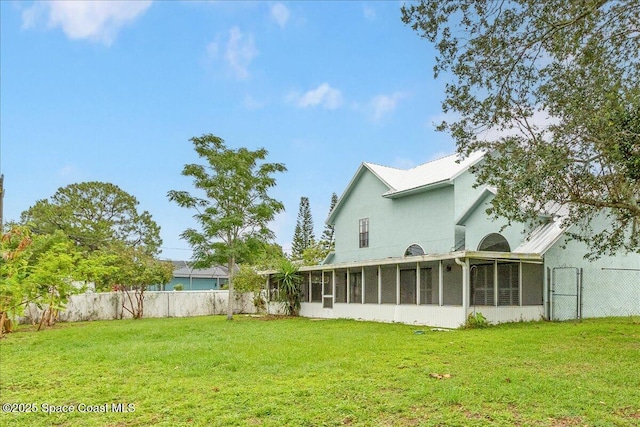 817 Seven Gables Cir SE, Palm Bay, FL 32909 - back of house with a sunroom, a gate, and stucco siding
