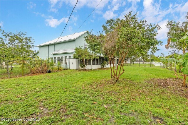 817 Seven Gables Cir SE, Palm Bay, FL 32909 - view of yard with a sunroom
