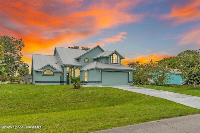 817 Seven Gables Cir SE, Palm Bay, FL 32909 - view of front of home featuring concrete driveway, a yard, a garage, and metal roof