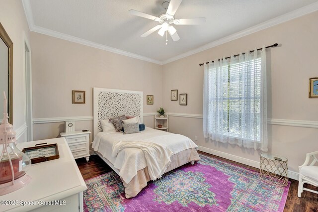 105 38th Ct, Vero Beach, FL 32968 - bedroom with dark wood-style floors, crown molding, baseboards, and a ceiling fan